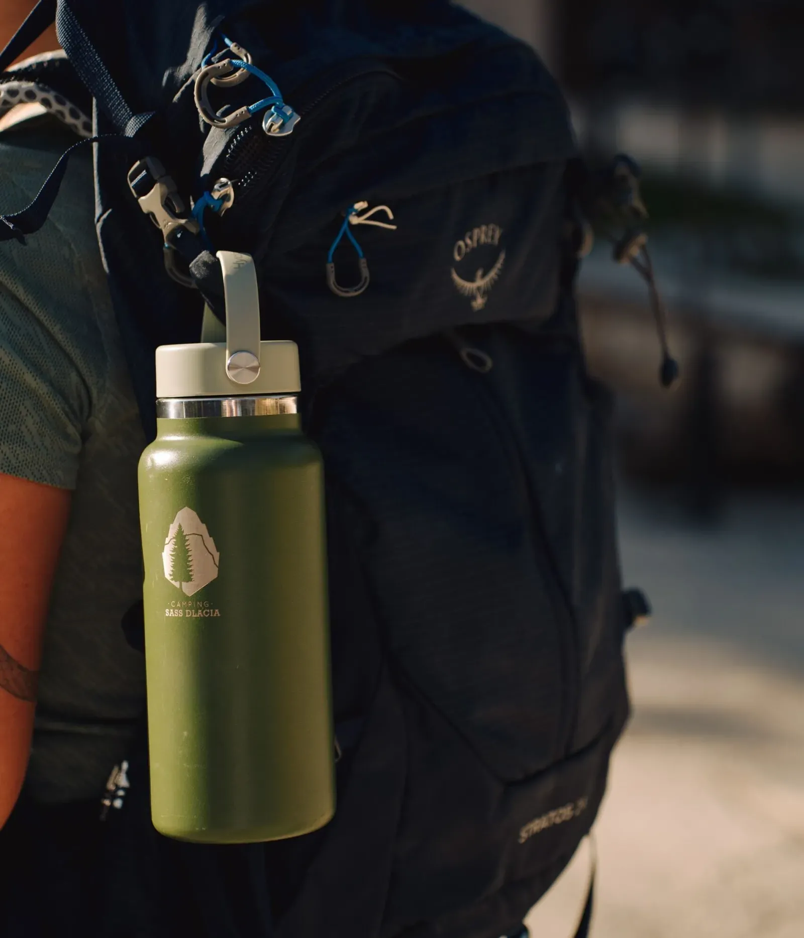 Green flask with backpack